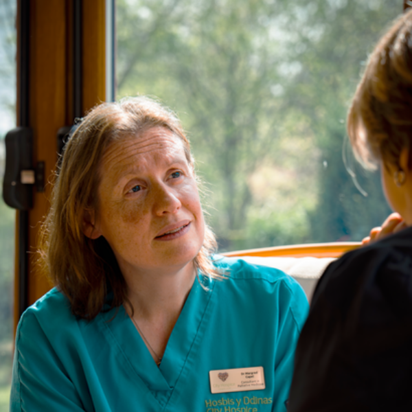 Margred talking to patient