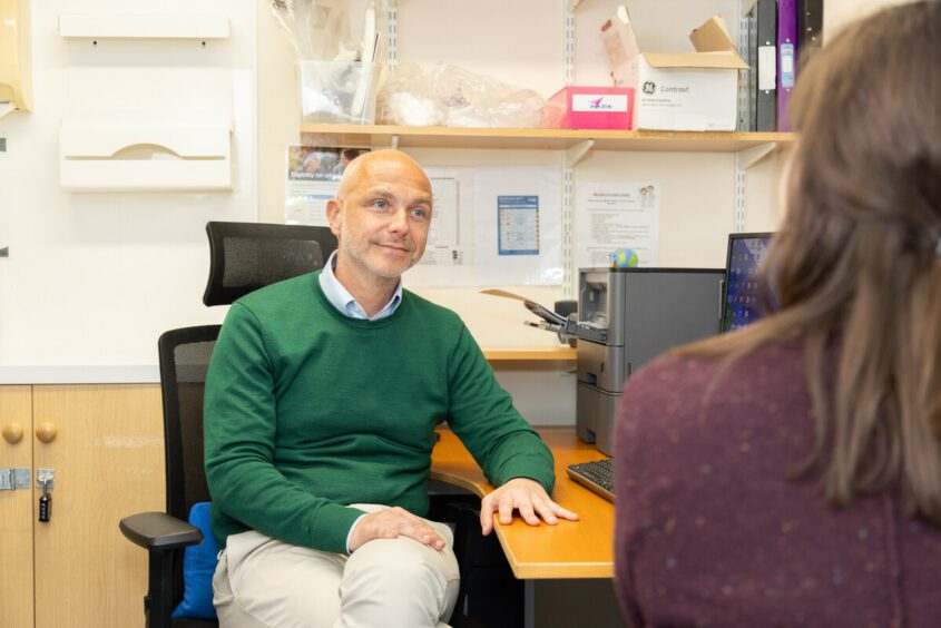 GP talking to patient