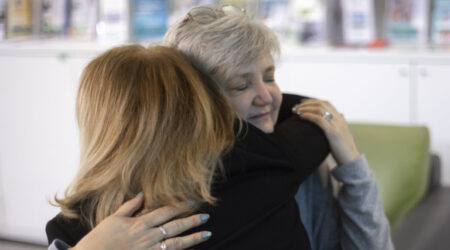 Two women hugging