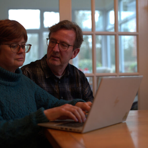 Man and woman looking at computer